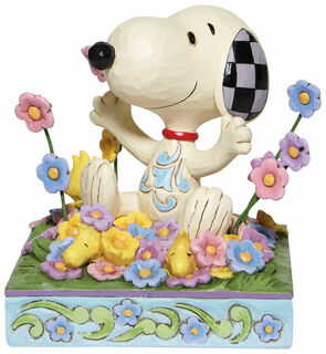 Sculpture "Snoopy dans un parterre de fleurs", fonte